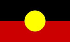 The Aboriginal Flag features a black upper half, red lower half, and a yellow circle in the center.