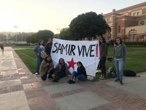 Group holding a "Samir Vive!" banner with a red star, UCLA campus. Eagle and the Condor Liberation Front.