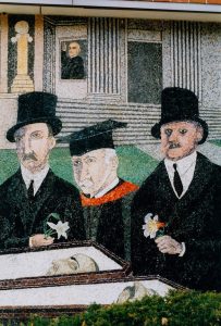 The Passion of Sacco and Vanzetti mosaic depicting a funeral procession with men in top hats.