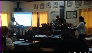 Ahunah Hydropower Dam project discussion in a council meeting room.